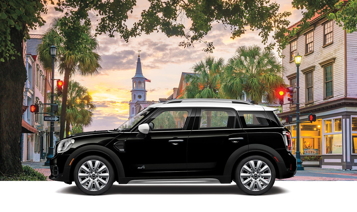 Oxford Hardtop 4 door parked in front of a city landscape.