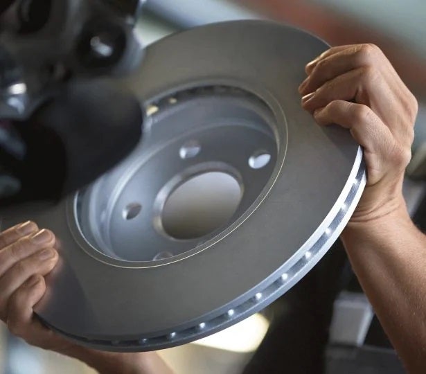 A certified MINI technician performance maintenance.