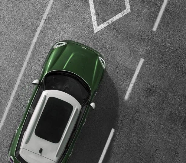 An electric MINI in the HOV lane from a bird’s eye view.