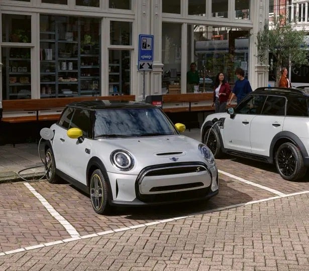 An electric MINI parked in prime parking spot.