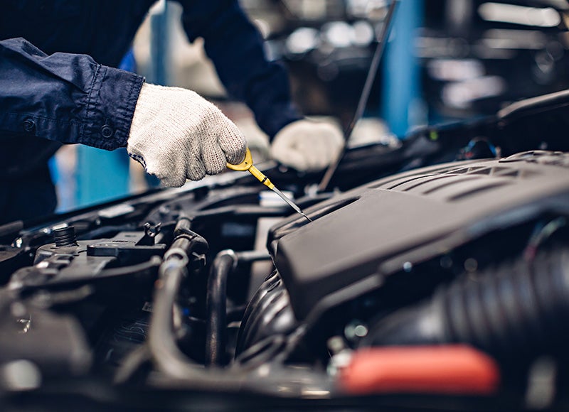 Technician servicing a car